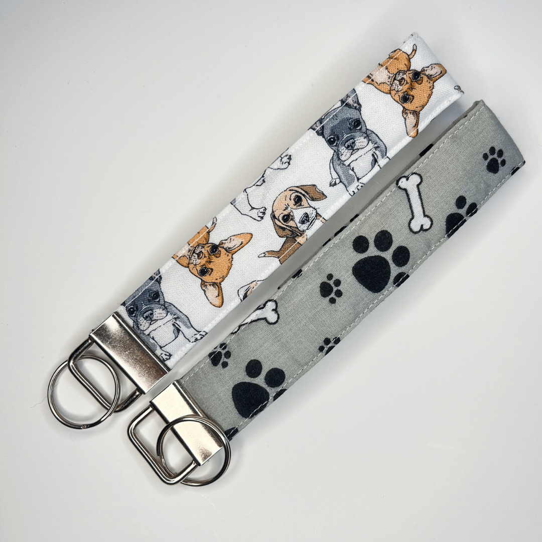 Dog keychain wristlet and paw print keychain wristlet.