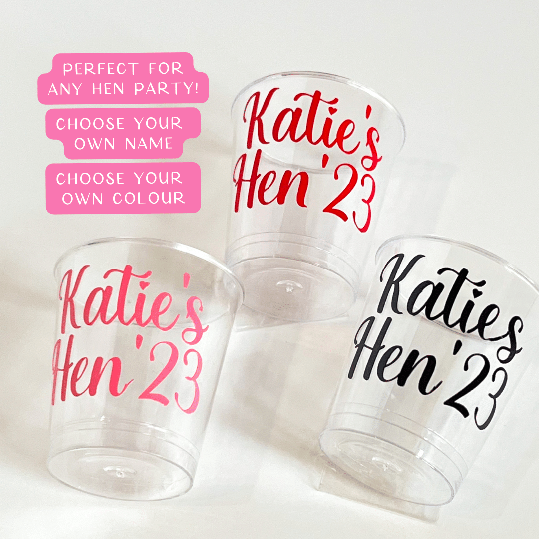 Personalised plastic hen party shot glasses.