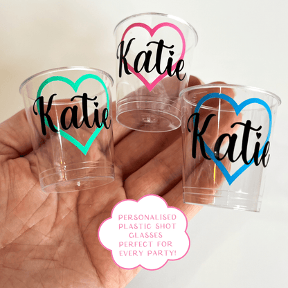 Personalised heart plastic shot glasses.