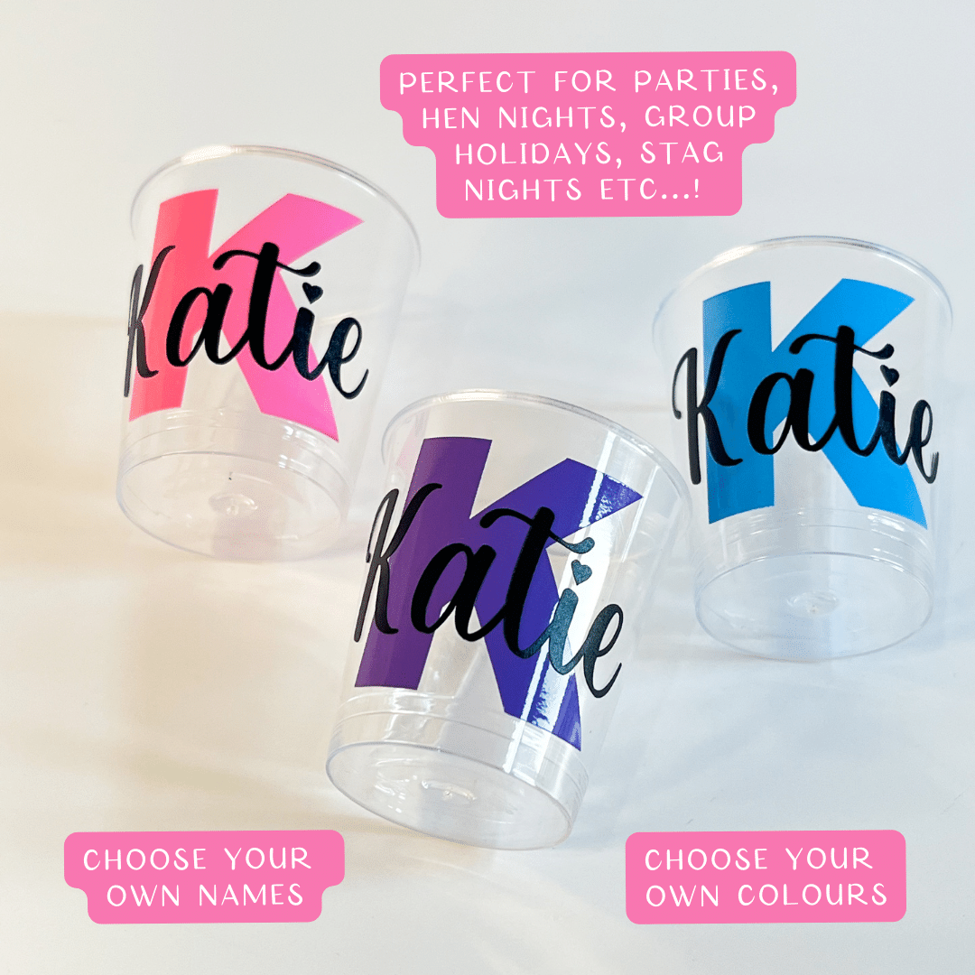 Personalised plastic name shot glasses.